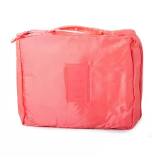 Lazac színű utazó kozmetikai táska nyitott állapotban, látható belső rekeszekkel és rendszerezővel